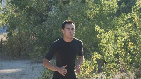Athlete jogging in the park Stock Footage 111631754