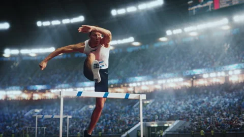 Athlete Jumping Over Hurdle Stock Footage 260704734