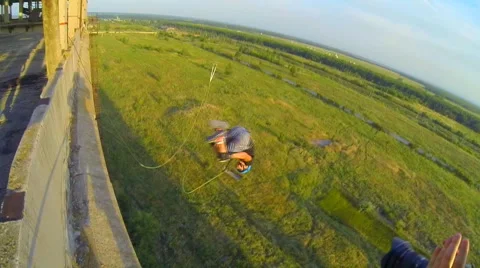 Athlete jumps facing forward, making a difficult jump somersault Stock Footage 41431310