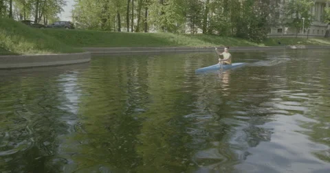 Athlete in a kayak will float by Stock Footage 63939772