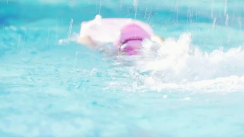 Athlete kid practice swimming in the pool, slow motion footage Stock Footage 91644928