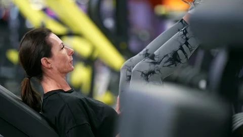 An athlete in leggings with an abstract pattern demonstrates endurance  Stock Footage 299529002