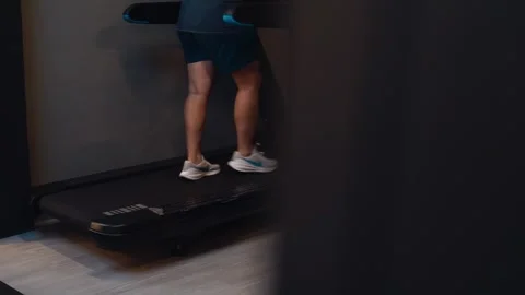 Athlete legs jogging on running machine Video stock 346301921