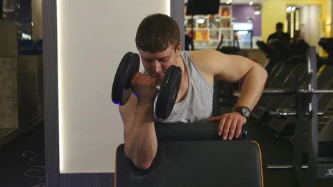 Athlete is Lifting Dumbbell Stock Footage 75350149