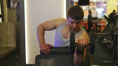 Athlete is Lifting Dumbbell Stock Footage 75350454
