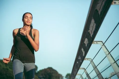 Athlete looking away while running stock photo Stock Photos