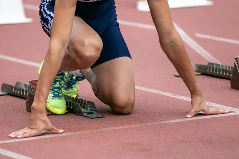 Athlete at low start from starting block Stock Photos