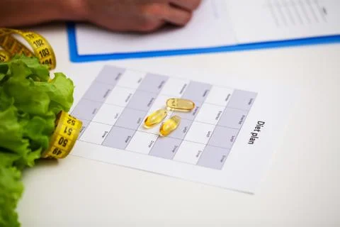 Athlete makes a diet plan for proper nutrition Stock Photos