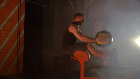 The athlete makes exercises for the press on the simulator with the ball Video stock 86081451