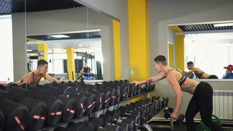 The athlete makes exercises to strengthen the biceps, triceps and back muscles. Stock Footage