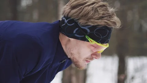 Athlete man resting after run. Detail on face breathing in winter Stock Footage 124729098