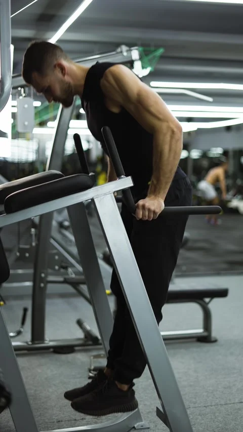 Athlete man training force push up and pull up exercise on bars in gym 스톡 동영상 272179750