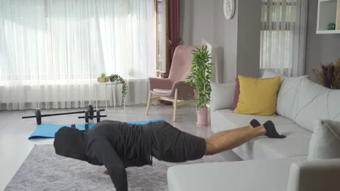 Athlete man is training at home. Stock Footage 219731987