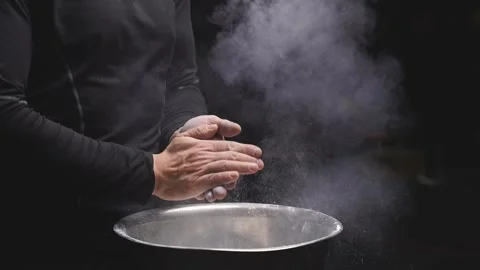 Athlete man using talc powder before workout at gym Stock Footage 148470753