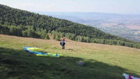 Athlete paraglider waiting for the wind to get stronger to fly. Bad wind Stock Footage 261503025
