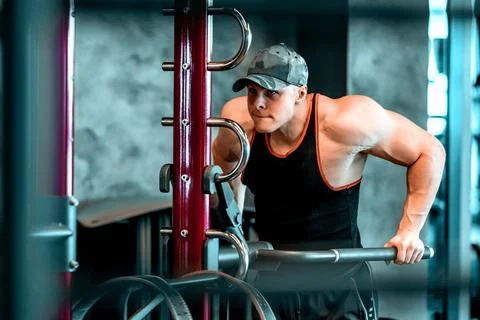 Athlete on parallel bars in the gym 스톡 사진
