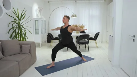 Athlete performs difficult exercise during stretching session Stock Footage 237283828