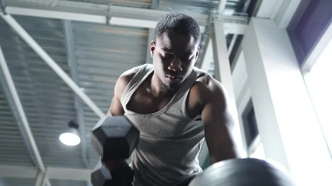 Athlete Performs Dumbbell Rows at Gym Video stock 98794211