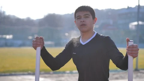Athlete performs exercises on an exercising machine Stock Footage 125807122