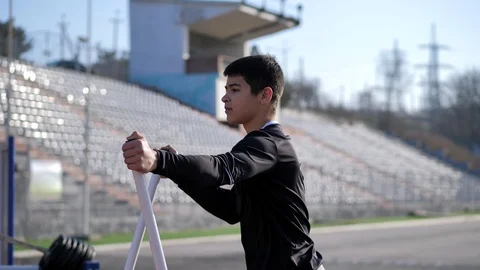 Athlete performs exercises on an exercising machine Stock Footage 125807419