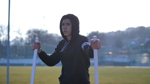 Athlete performs exercises on an exercising machine Stock Footage 125815541