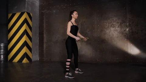 Athlete performs exercises from the group program with dumbbells. Stock Footage 104720880