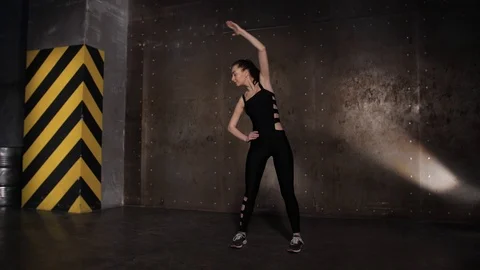 Athlete performs exercises from the group program with dumbbells. Stock Footage 104721053