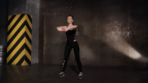 Athlete performs exercises from the group program with dumbbells. Stock Footage 104721154