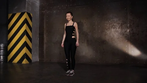 Athlete performs exercises from the group program with dumbbells. Stock Footage 104721326