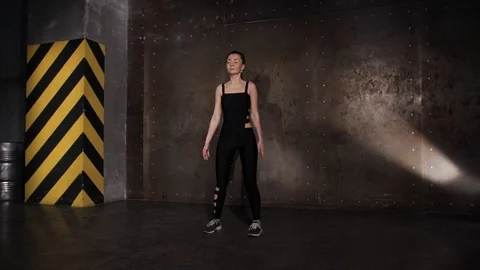 Athlete performs exercises from the group program with dumbbells. Stock Footage 104721379