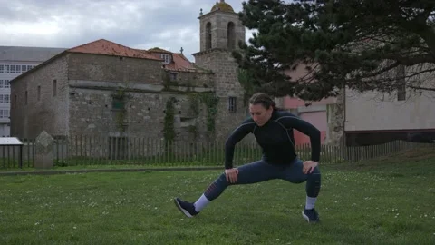 The athlete performs exercises on the street. Stock Footage 172106931