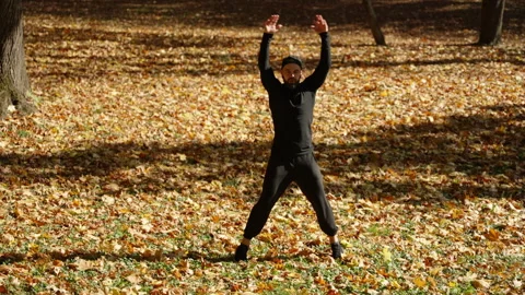 The athlete performs jumps on the spot Stock Footage 248534323