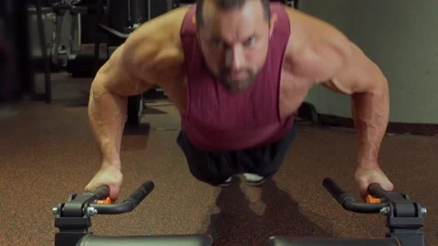 Athlete performs push ups in the gym . Sports training, healthy lifestyle Stock Footage 189952983