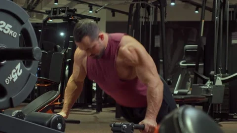 Athlete performs push ups in the gym . Sports training, healthy lifestyle Video stock 189953236
