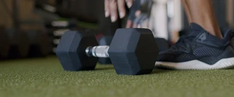 Athlete Picking Up Dumbbell (SLOW MOTION) Stock Footage