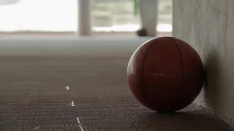 Athlete Picking Up Red Training Ball from Corner Stock Footage 110483506