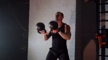 The athlete picks up the weights up in the gym Stock Footage 86077387