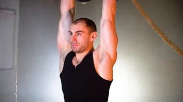The athlete picks up the weights up in the gym Vídeo Stock 86077546