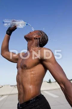 Athlete Pouring Water On Himself