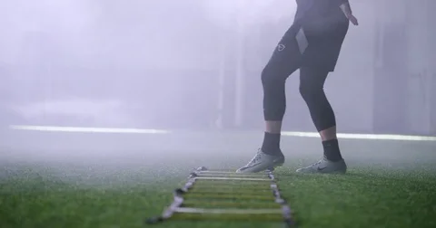 Athlete practicing exercise on agility ladder in fitness studio Stock-Footage 78199074