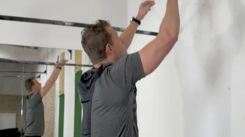 Athlete practicing wall ball shots with a med ball at the gym. Stock Footage 112719407