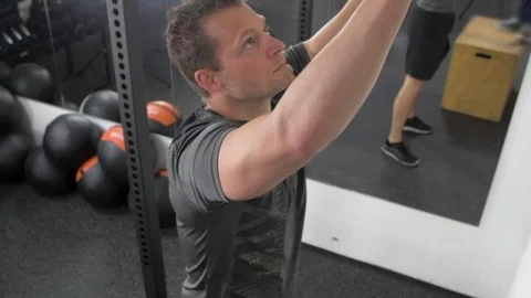 Athlete practicing wall ball shots with a med ball at the gym. Stock Footage 113482843