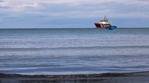 Athlete practise hydro foil wing surfing against an emergency towing vessel Stock Footage 287922920