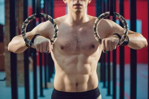 Athlete prepare for exercise on rings Stock Photos