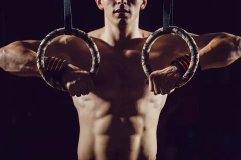 Athlete prepare for exercise on rings Stock Photos