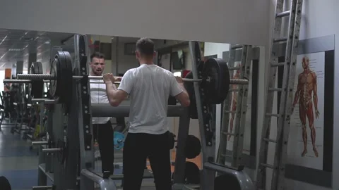 An athlete prepares for barbell exercise. Slow motion Stock Footage 132173656
