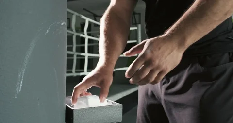 Athlete is preparing, hands claps after magnesia in fitness center Stock Footage 116345987