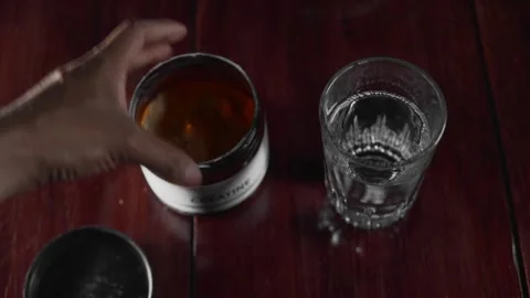 Athlete preparing monohydrate drink for muscle building Video stock 330190331