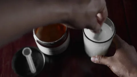 Athlete preparing a performance drink with amino acids Stock Footage 330190254
