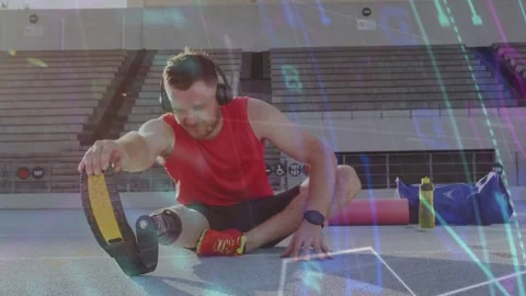 Athlete preparing for run on track, reaching running blade to stretch leg while 스톡 동영상 333105490